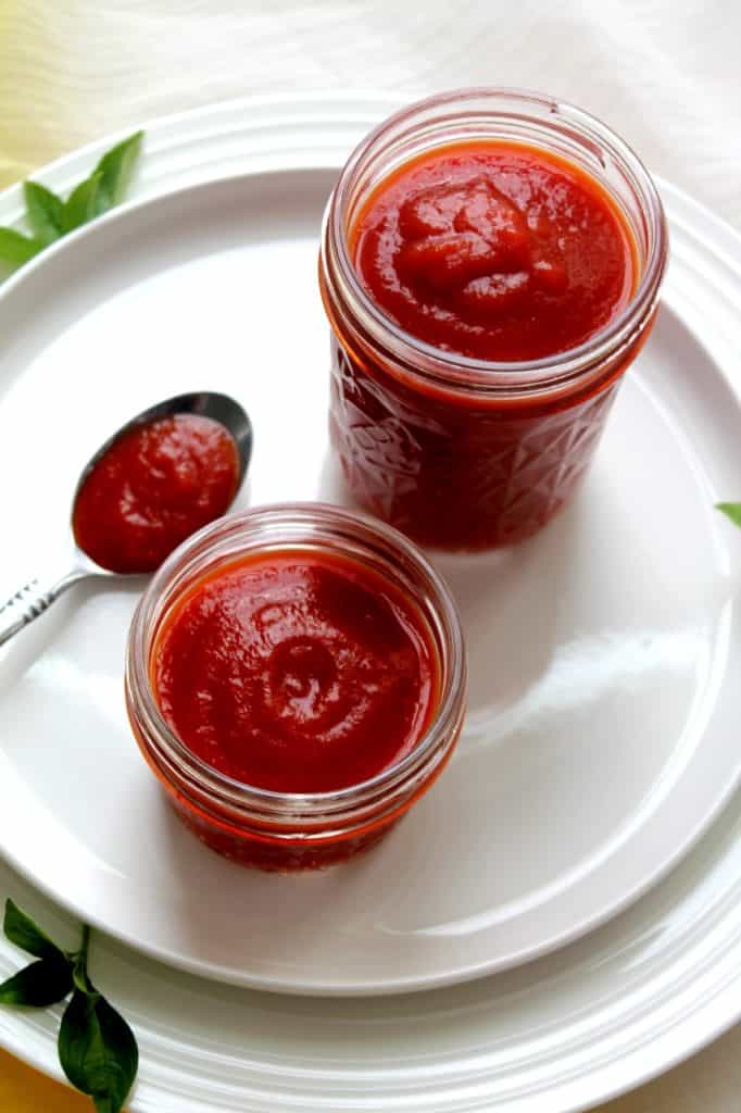 Homemade tomato ketchup stored in sterilized glass jars for 3-month shelf life