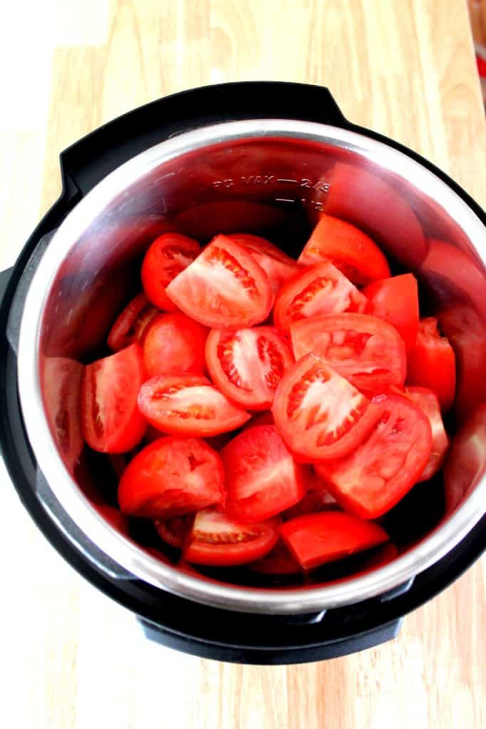 Fresh ripe Roma tomatoes halved and ready for Instant Pot ketchup