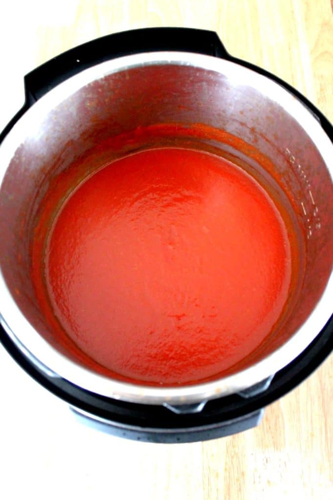 Thick and smooth homemade tomato ketchup texture closeup