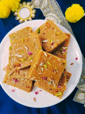 Besan burfi garnished with pistachios