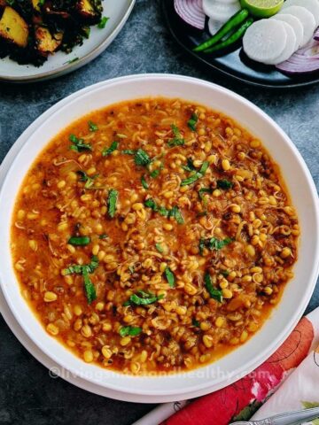 Sprouts curry with mung beans in onion-tomato masala served with steamed basmati rice