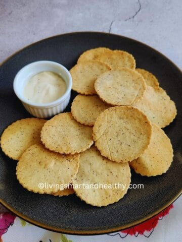 homemade almond flour crackers with dip on a serving platter