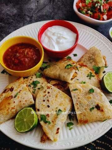 low carb Chicken and roasted poblano quesadilla served with yogurt dip, salsa and gucamole