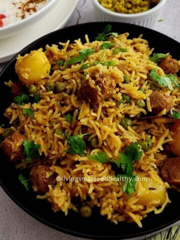 Soya chunks pulao with basmati rice, textured vegetable protein, and whole spices in a pot