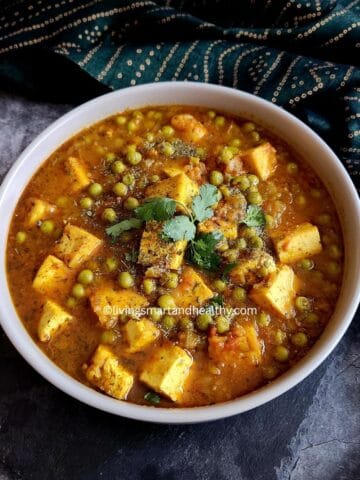 Vegan matar paneer with golden tofu cubes and green peas in spiced onion-tomato masala